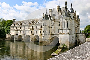 View of the Chenonceau Castle in the village Chenonceaux near the river Cher under a cloudy sky