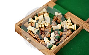 View of chess board and pieces in the box