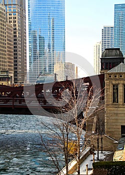 View of a Chicago bridge and bridgehouse on an ice chunk covered, frozen Chicago River.