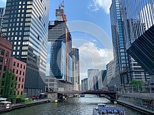 View of Chicago River looking south as tour boats pass restaurants and construction site