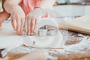 View of child cutting out cookings