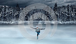 Hild figure skater on winter lake background