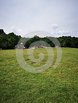 A view of a children playground in a park in the summer