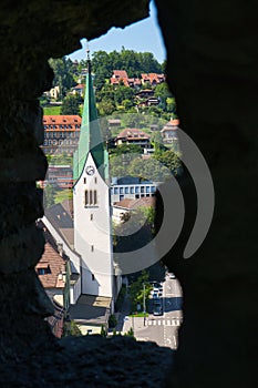 View of a church on Bled Lake from behind the wall in Slovenia, Europe