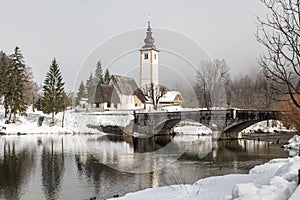 View on the church and bridge of lake Bohinj photo