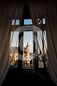 View of the church from the curtained window at Sternberk Castle