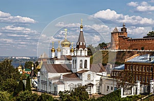 View of the Church of the Holy Prophet of God Elijah, the Kremlin wall with a tower and urban development. Nizhny Novgorod