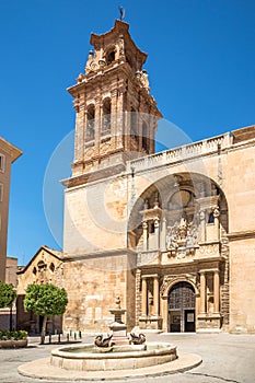 View at the Church La Asuncion with fountain in the streets of  Almansa in Spain
