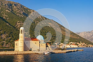 View of Church of Our Lady of the Rocks Gospa od Skrpjela on sunny summer day. Montenegro, Bay of Kotor