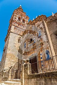 View at the church of Saint Bartholomeus in the streets of Jerez de los Caballeros - Spain