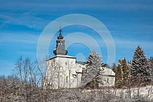 View of church in snowy winter landscape