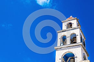 View on church tower with bell, Greece