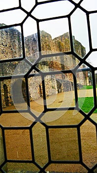 View of the Château de Sainte-Suzanne-et-Chammes through the stained glass window. Erve Valley in Mayenne France