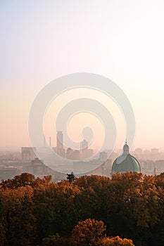 View from Cidneo Hill top to silhouette of skyscrapers in business part of Brescia and dome of New Cathedral photo