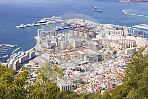 View of the city below, the ocean and the beach from the height of the Rock of Gibraltar