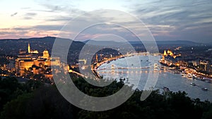 view of the city of budapest at sunset from citadella