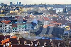 View of the city and city streets, architecture and roofs houses from above. Prague