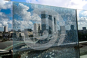 View of a city through cracked glass