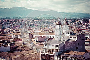 View of the city of Cuenca, Ecuador, with it`s many churches at sunny summer day. South America