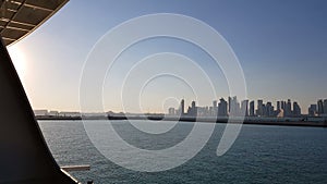 View of the city from the deck of the ship.Sea port and view of the city with skyscrapers on the horizon. Sea port with