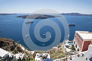 View from the city of Fira on the caldera with tourist ships, cruise liners. Santorini,