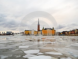 View of the city of Gamla Stan in Stockholm & x28;Sweden& x29; during winter with the frozen river