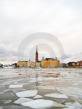 View of the city of Gamla Stan in Stockholm & x28;Sweden& x29; during winter with the frozen river