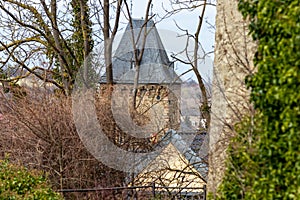 View at city gate Werther Tor in Bad Muenstereifel with trees in the foreground