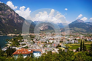 View of the city in Italy Riva del Garda from a height and the high mountains of the Alps, Lake Garda.