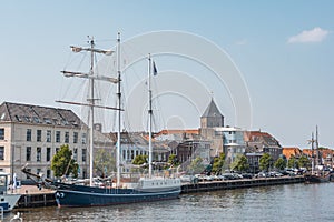 View of the city of kampen from the harbor with schooner netherlands holland