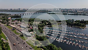 View of the city of Kiev across the Dnieper River, with a long bridge in the foreground. The bridge over the Dnieper