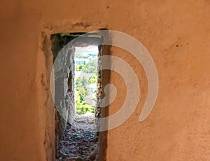 View of the city from the loophole of the observation tower on the upper wall of the Nitrograd castle in Nitra, Slovakia