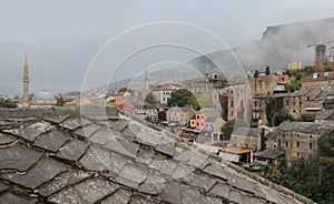 A view on city of Mostar at rainy and fogy day