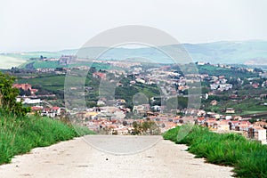 the view of the city from the mountains, the Italian house at the foot of the mountains, town between mountains, panoramic landsca