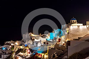 View of the city at night. Oia, Santorini, Greece. beautiful sky with stars