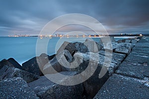 View on city and pier from rocky headland