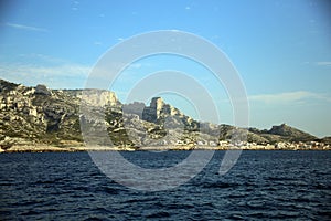 View of the city on the tree-lined and rocky coast, Parc National des Calanques, Marseille, France