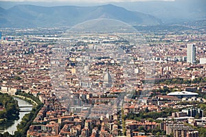 View of the city of Turin from Superga Church. Mole Antonelliana tower, skyscraper San Paolo and the river.