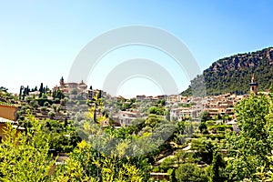 View on city Valldemossa with traditional flower decoration, famous old mediterranean village of Majorca. Balearic