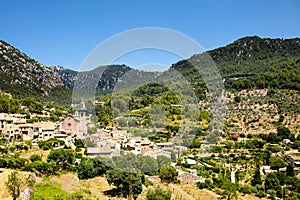 View on city Valldemossa with traditional flower decoration, famous old mediterranean village of Majorca. Balearic