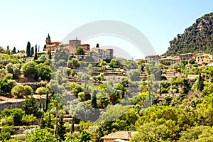 View on city Valldemossa with traditional flower decoration, famous old mediterranean village of Majorca. Balearic