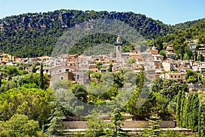 View on city Valldemossa with traditional flower decoration, famous old mediterranean village of Majorca. Balearic