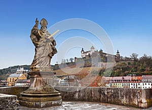 View of the city of Wurzburg, the old Alta Mainbrucke bridge with the sculpture of St. Kilian and the fortress of Marienberg. Bava