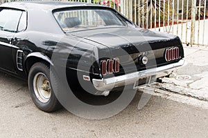 A view of a classic vintage antique car in the street in Los Angeles