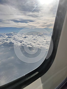 view of the clear sky from the window of the ATR-72 aircraft