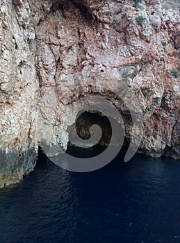 View of the cliff and the entrance to the underwater cave