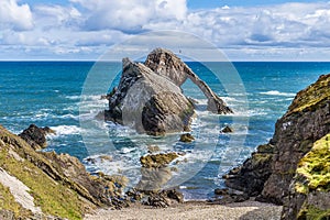 A view from the cliff top looking down towards the Bow Fiddle Rock at Portknockie, Scotland