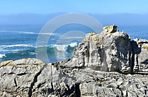 View from a cliff with waves breaking at famous Rias Baixas in Galicia Region. Spain.