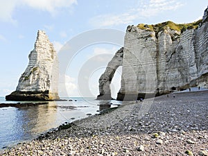 View of cliffs with arch on english channel beach