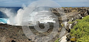 View of cliffs and blowhole in La Espanola island photo